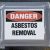 17857757 - danger asbestos removal sign posted on school window.